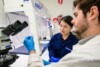 Airsafe analysts examining an asbestos sample in the laboratory