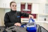 Airsafe consultant unpacking a DustTrak DRX dust monitor from its case