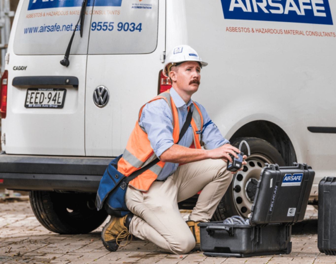 Airsafe employee in front of an Airsafe van