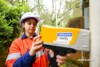 Airsafe consultant checking results on an Olympus Vanta XRF analyser during lead paint testing