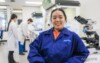 An Airsafe team member with colleagues at work in the Beaconsfield laboratory