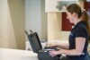 Airsafe consultant with an open equipment case on a kitchen bench during a residential testing visit